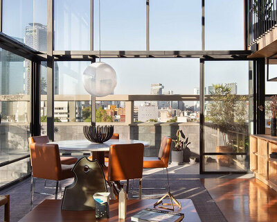 modern penthouse overlooking mexican cityscape encapsulates the international style