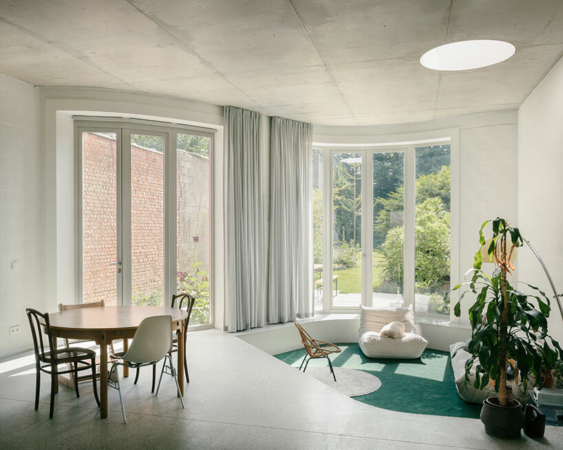 poot architectuur infuses delicate lines & curves inside minimal house in belgium