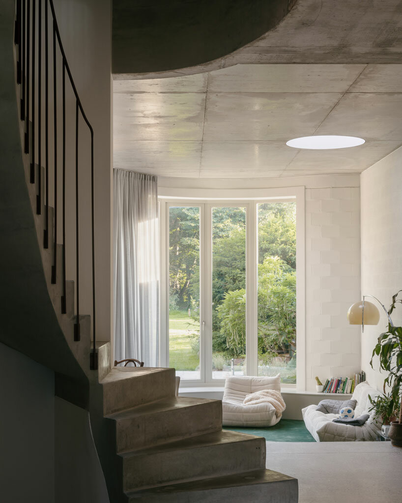 delicate lines and curves engage in visual play within minimal house in belgium