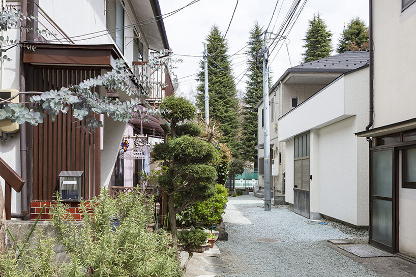 sato+ lodges semi-open house with transparent roof into narrow alley in sendai, japan