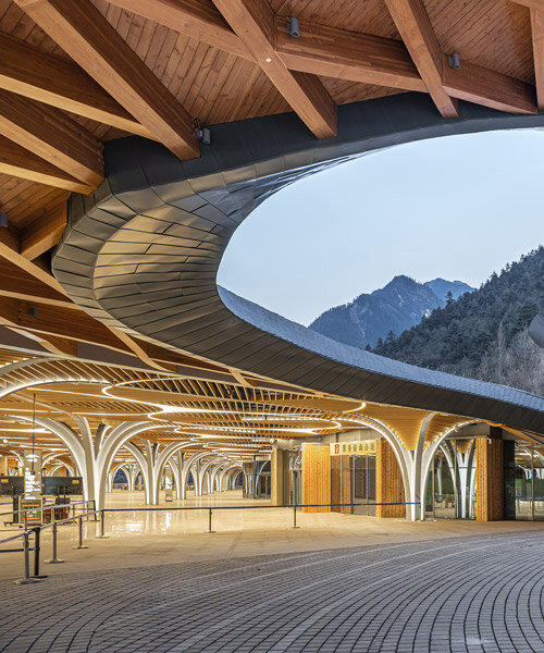 jiuzhai valley visitor center is a fluid extension of the national park's landscape