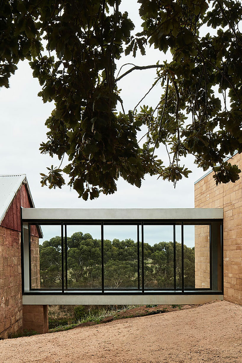 glazed walkways tie minimalistic farmhouse into rural victoria