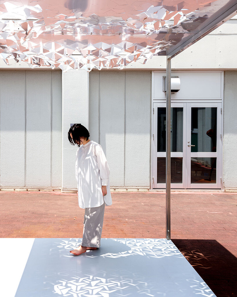 drawing from japanese paper cutting art, the auxetic pavilion filters sunlight like a tree