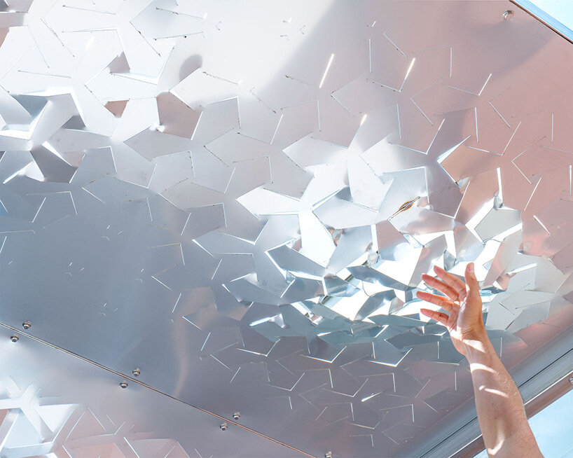 drawing from japanese paper cutting art, the auxetic pavilion filters sunlight like a tree