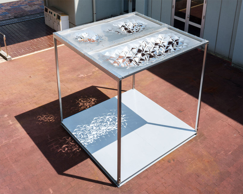 drawing from japanese paper cutting art, the auxetic pavilion filters sunlight like a tree