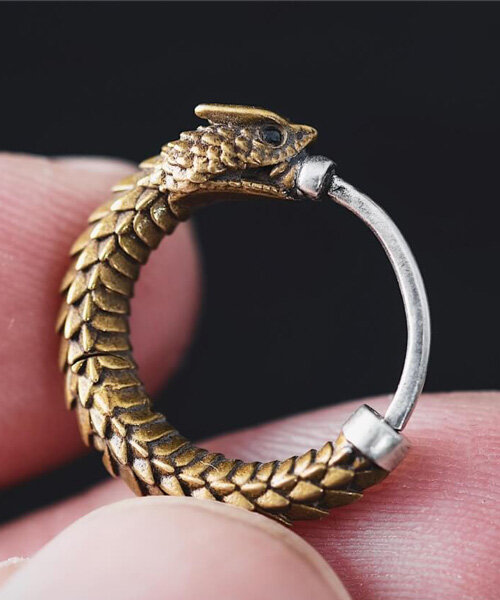 brass rattlesnake earrings by coppertist.wu embody ancient symbol of hope + eternity