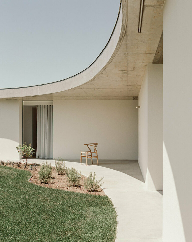 verdant circular patios contrast with orthogonal forms in bruno dias' casa âmago in portugal