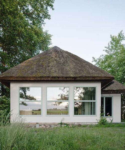 revived thatched cottage creates a vibrant getaway along the german lakeside