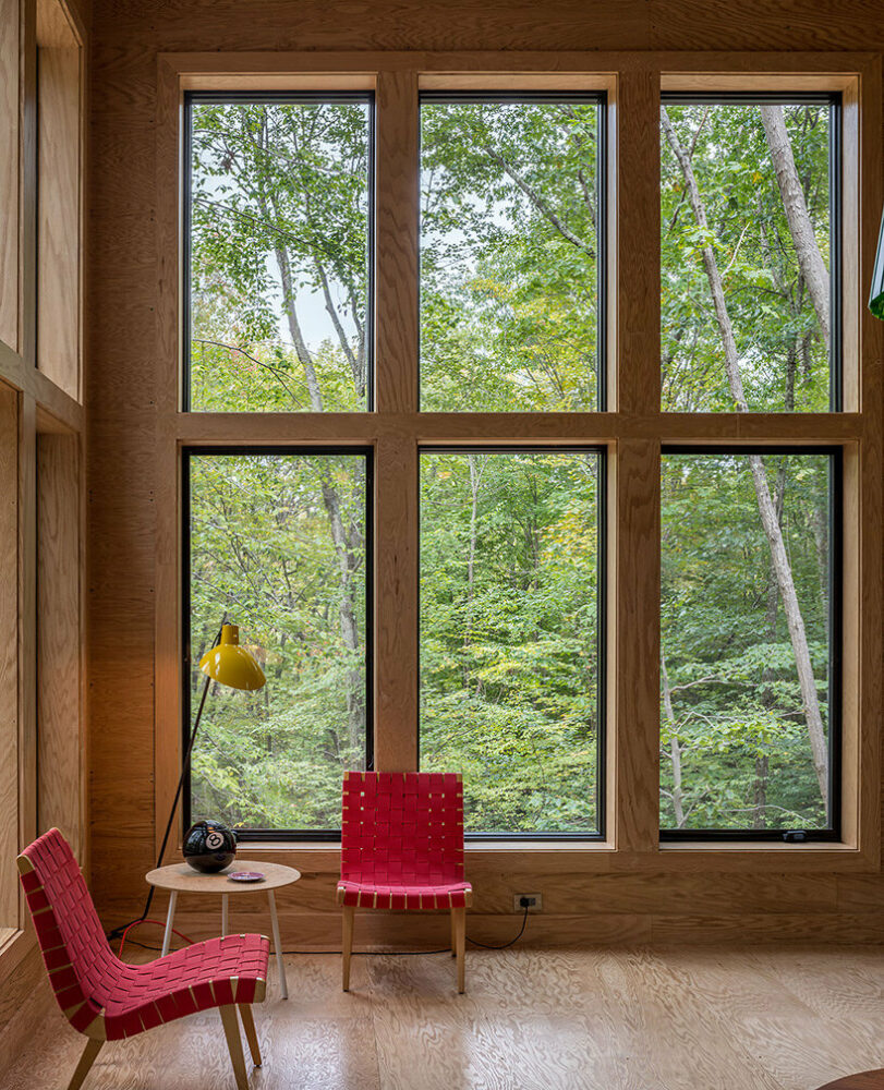 secluded cabin by scalar architecture hovers lightly above sloping terrain in connecticut