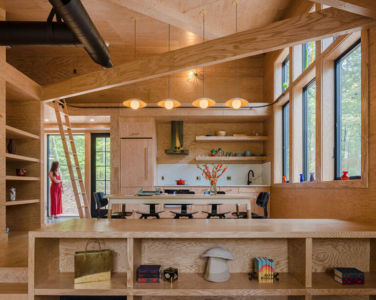 secluded cabin by scalar architecture hovers lightly above sloping ...