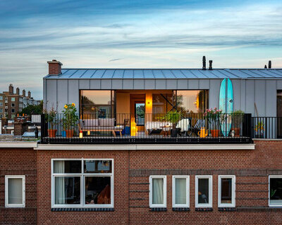 'house on a house' steel roof extension pops up in hague's brick cityscape