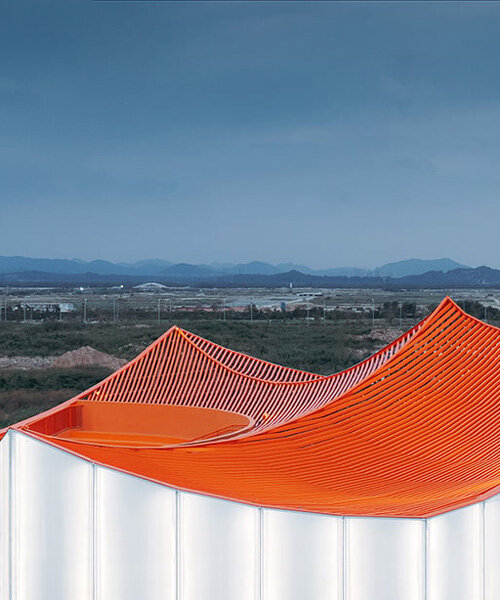 wutopia lab's floating showroom with sweeping orange peaks echoes chinese mountainscape