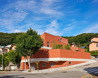 red brick residence in seongnam stacks fragmented three-story volume
