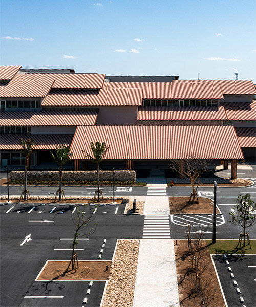 overlapping roofs top kengo kuma's reconstructed city hall in tsunami prone ishigaki island