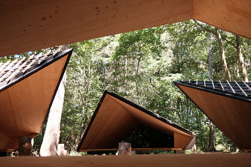 set in rural denmark, kvorning design's triangular shelters redefine outdoor learning