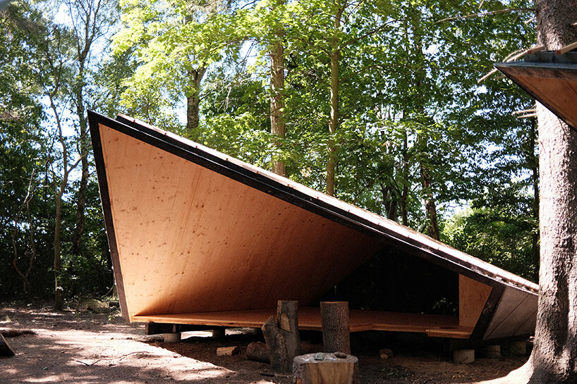 set in rural denmark, kvorning design's triangular shelters redefine outdoor learning