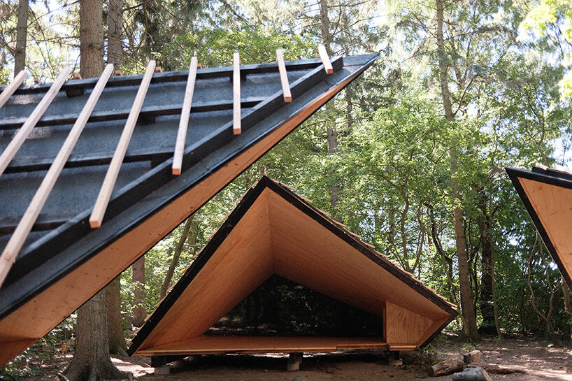 set in rural denmark, kvorning design's triangular shelters redefine outdoor learning