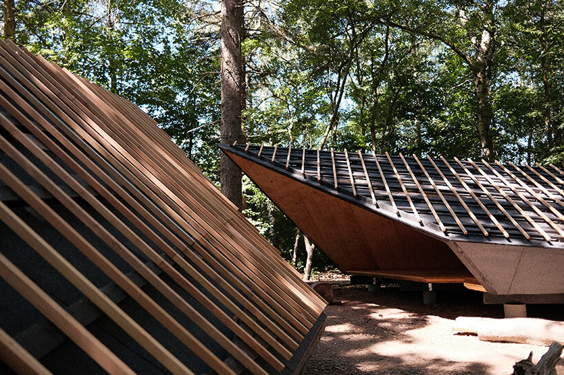 set in rural denmark, kvorning design's triangular shelters redefine outdoor learning