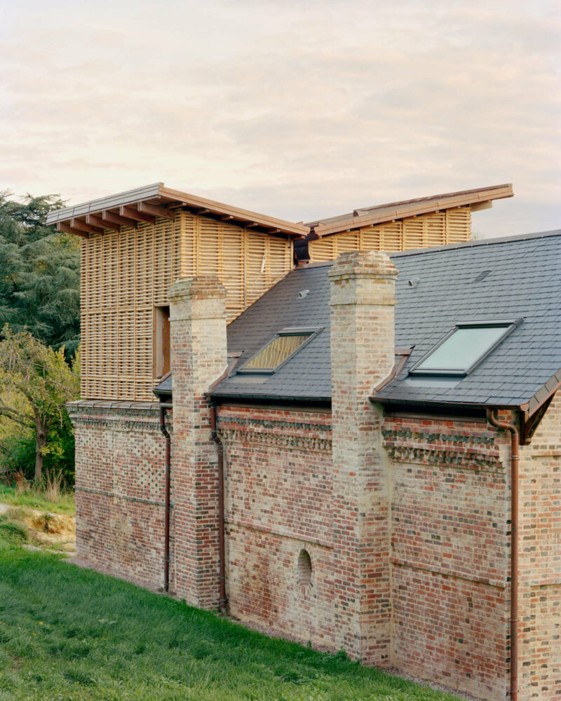 This traditional brick home has been brought to life in Normandy using only natural materials