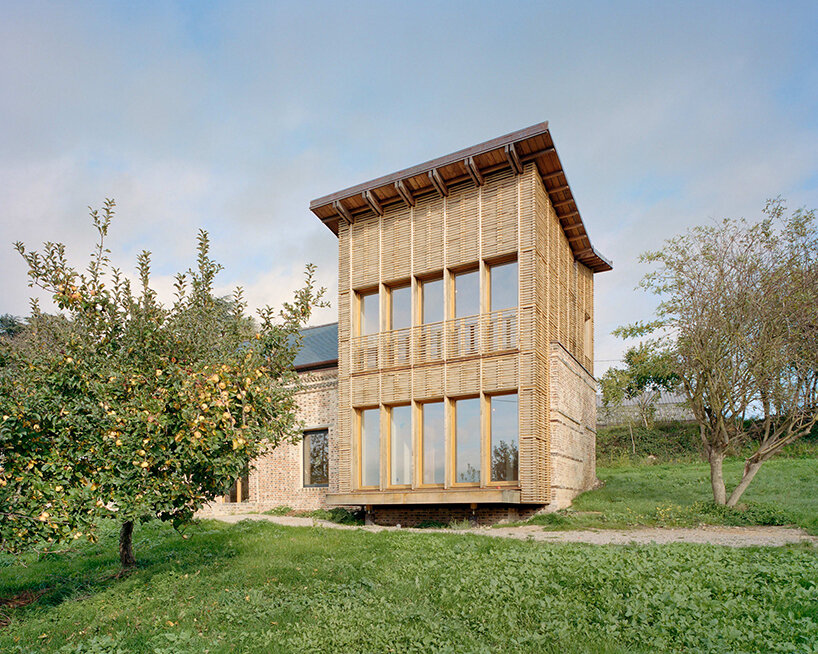 using only natural materials, this traditional brick house is given new life in normandy