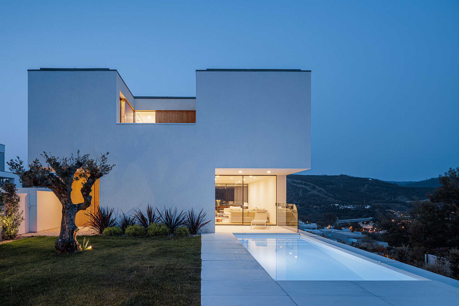 minimalist house by mário alves emerges from the hills of portugal