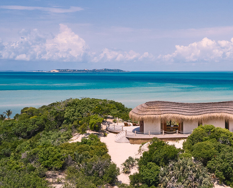 'kisawa' resort weaves undulating thatched-roof villas into the sand dunes of mozambique