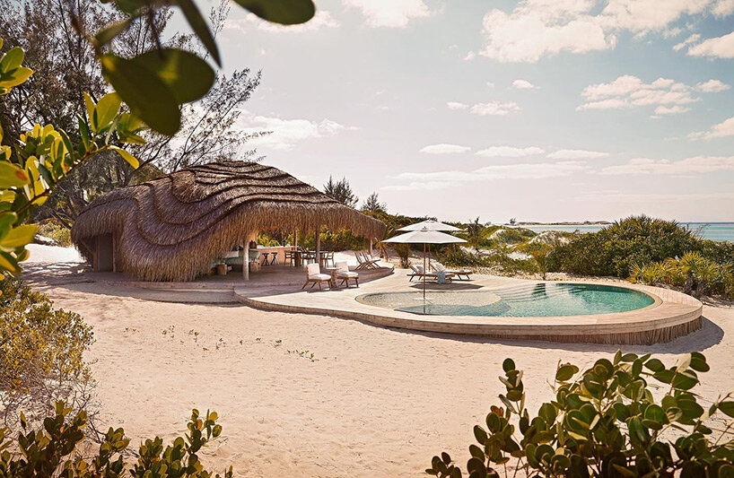 'kisawa' resort weaves undulating thatched-roof villas into the sand dunes of mozambique