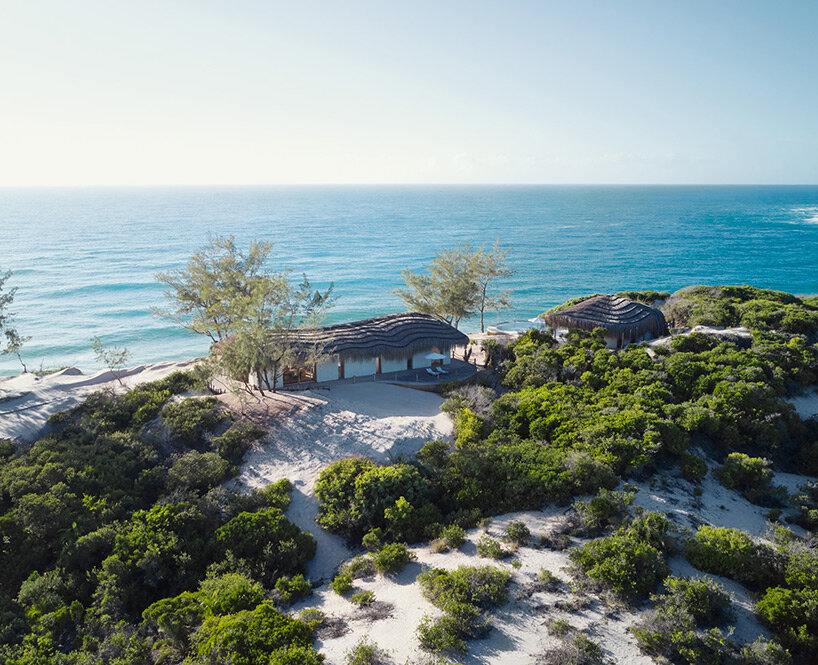 'kisawa' resort weaves undulating thatched-roof villas into the sand dunes of mozambique