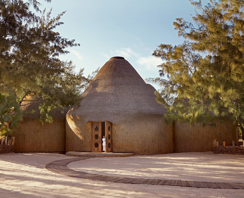 'kisawa' resort weaves undulating thatched-roof villas into the sand dunes of mozambique