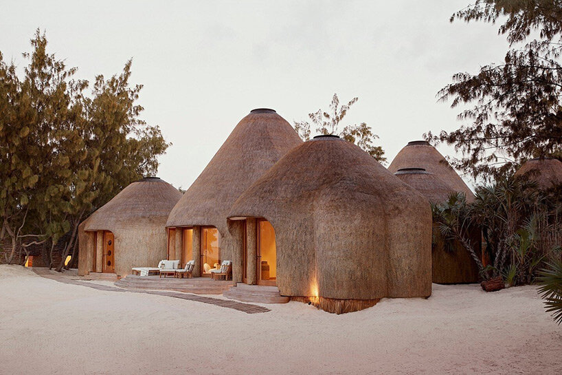 'kisawa' resort weaves undulating thatched-roof villas into the sand dunes of mozambique