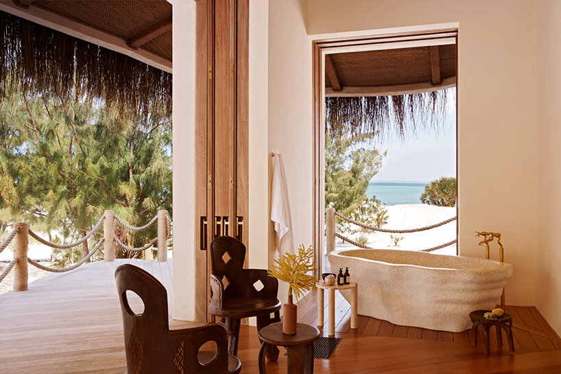 'kisawa' resort weaves undulating thatched-roof villas into the sand dunes of mozambique