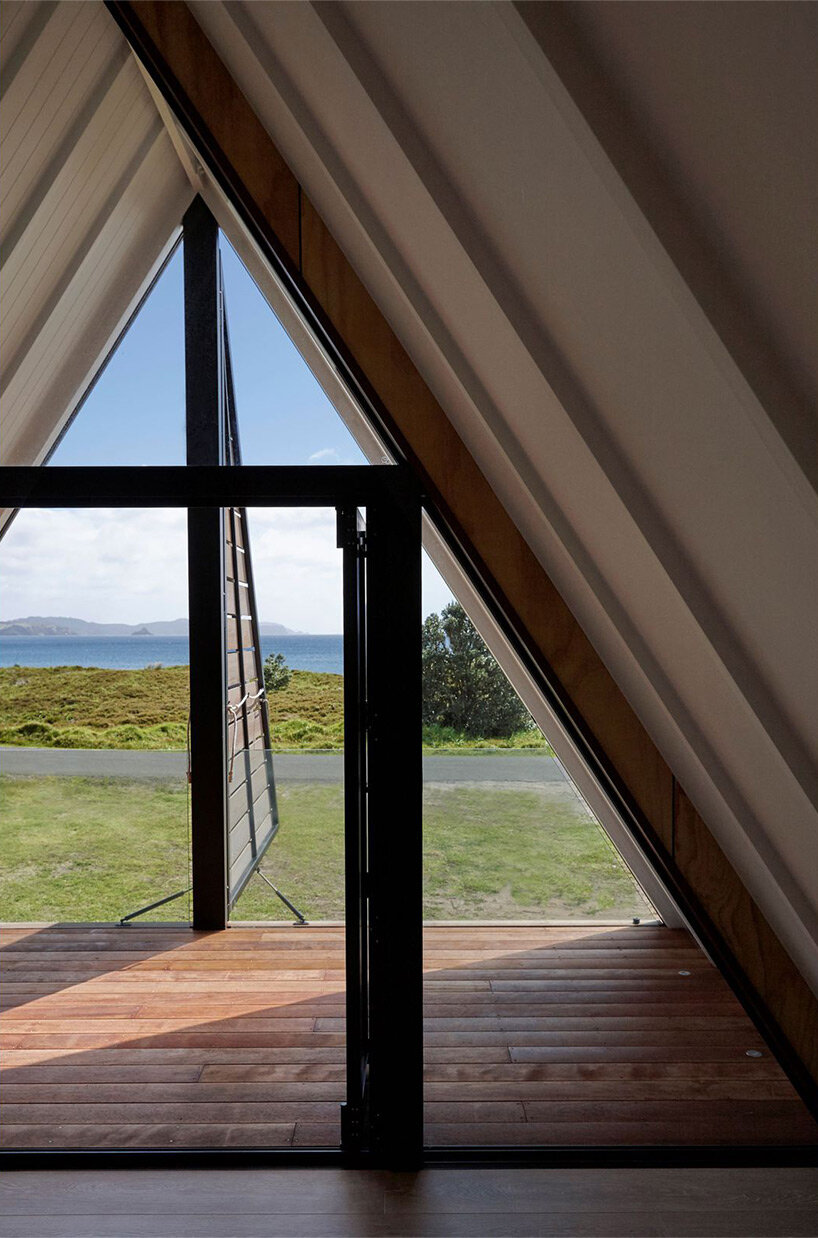 A-frame cabin in new zealand pays respect to local coastal landscape and maori culture