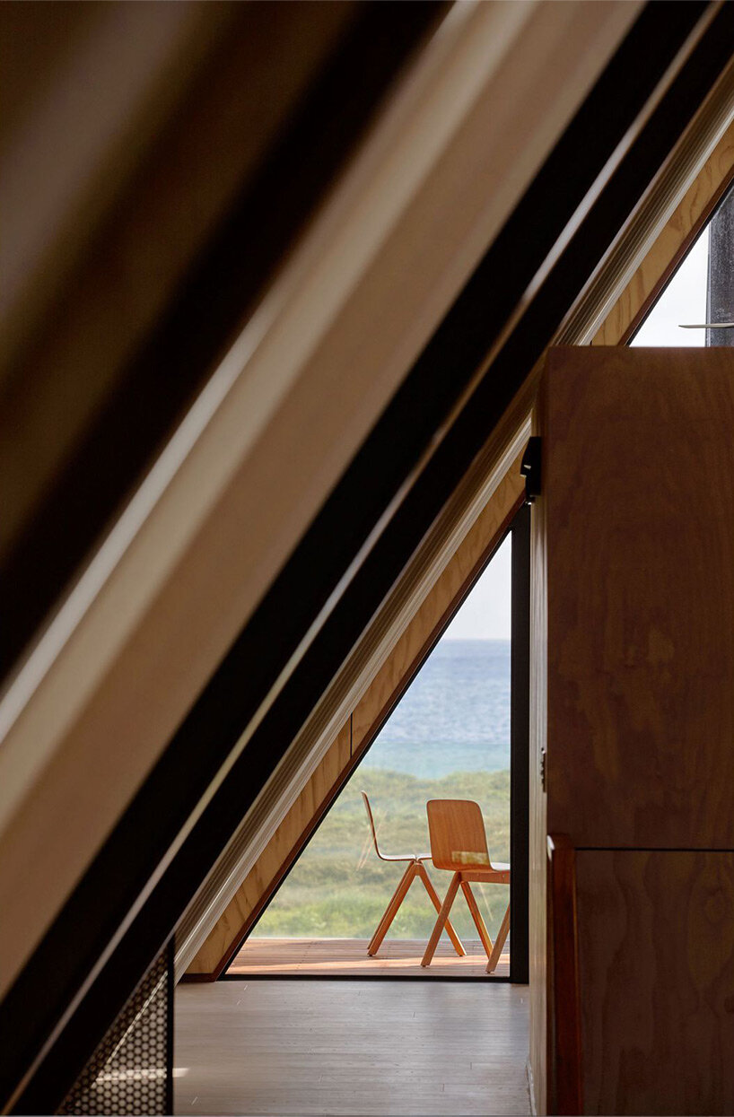 A-frame cabin in new zealand pays respect to local coastal landscape and maori culture