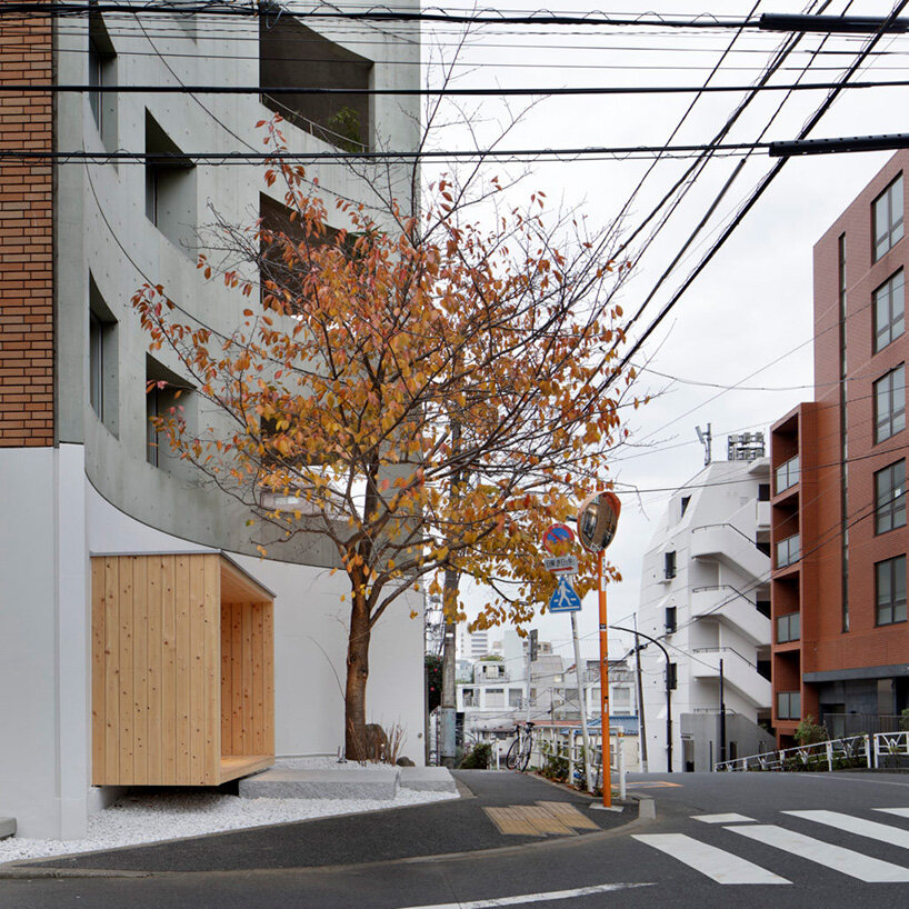 illuminated pastry shop in tokyo peeps out of extruded wooden frame 