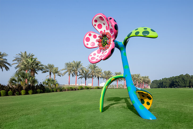 yayoi kusama's whimsical artworks land in qatar for expansive outdoor exhibition