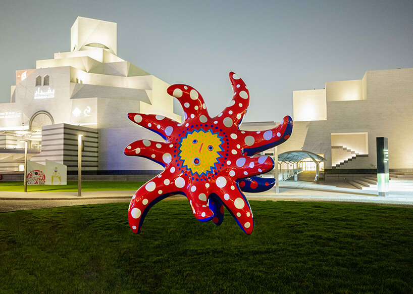 yayoi kusama's whimsical artworks land in qatar for expansive outdoor exhibition