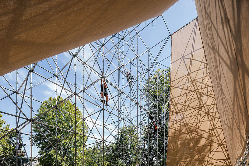 rising within a scaffold grid, P+S' AIRE pavilion creates a fragile atmosphere of air and light