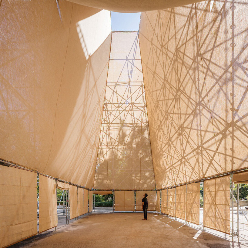 rising within a scaffold grid, P+S' AIRE pavilion creates a fragile atmosphere of air and light