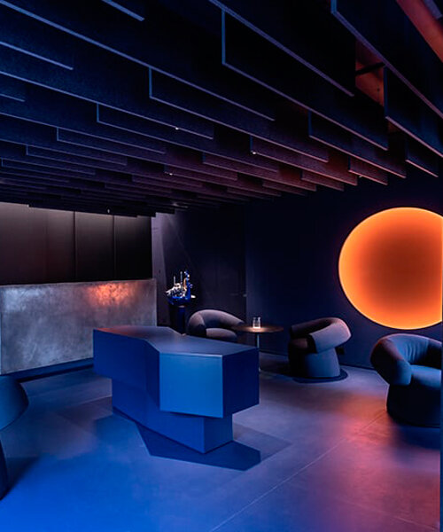 visual display immerses italian restaurant and bar lounge in neon orange light
