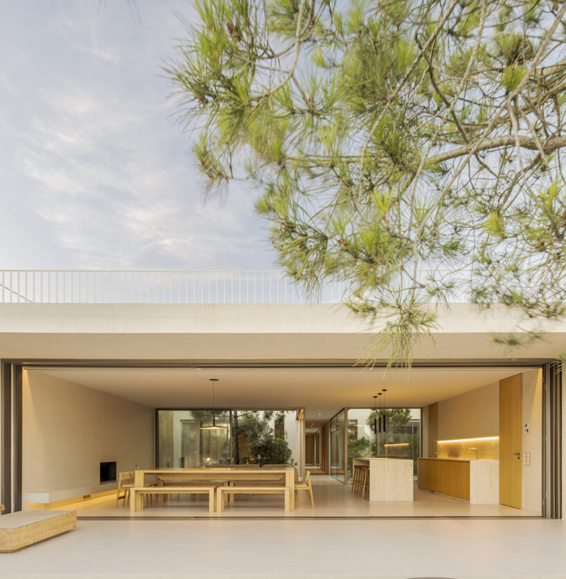 'casa em tróia' by BICA arquitectos seamlessly mirrors its coastal surroundings in portugal