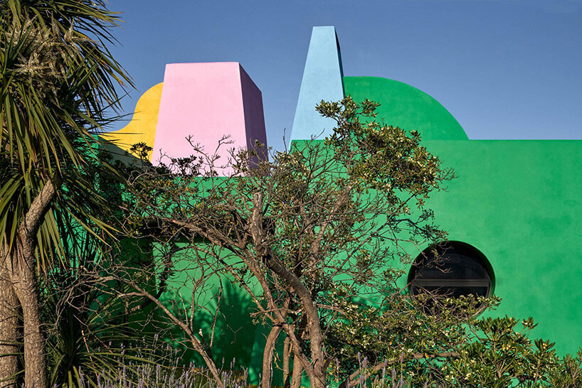 vibrant art center 'casa neptuna' stands out amid native forest landscape in uruguay