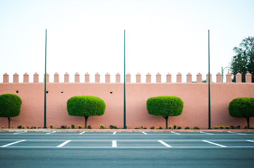 photo series captures the dusty rose hues blending morocco’s clay buildings and sandy lands