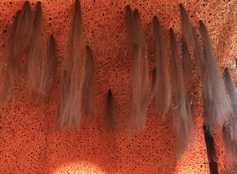 Hermès weaves a garden of life-size bamboo caves from recycled brushes in qatar