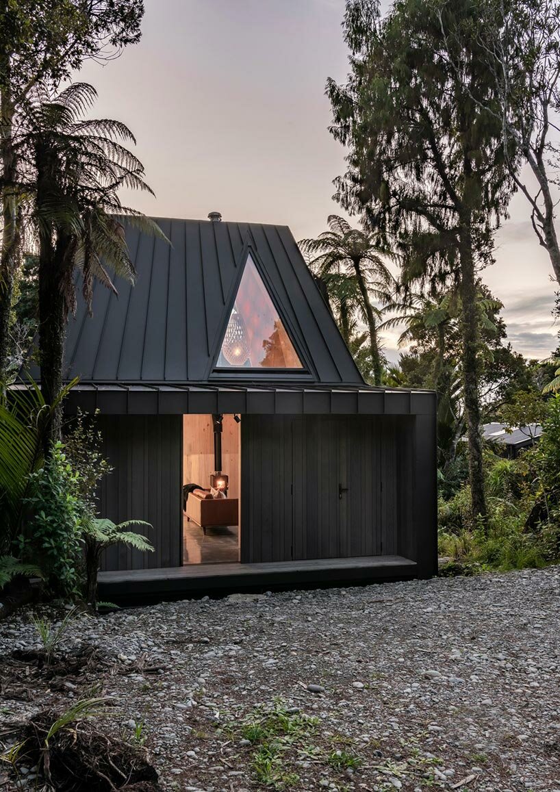 cut out skylights bring nature within biv cabin in new zealand