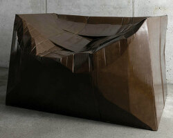 illya goldman gubin sculpts recycled furniture by pouring resin and fiberglass into cardboard