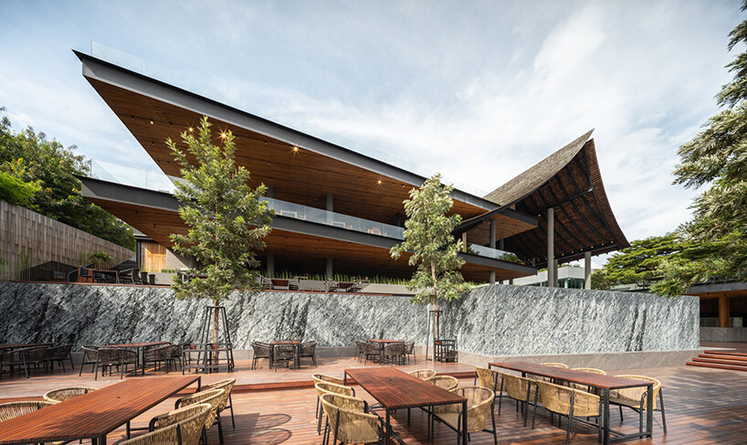 roof ridges dramatically collide atop the new keereetara restaurant in thailand