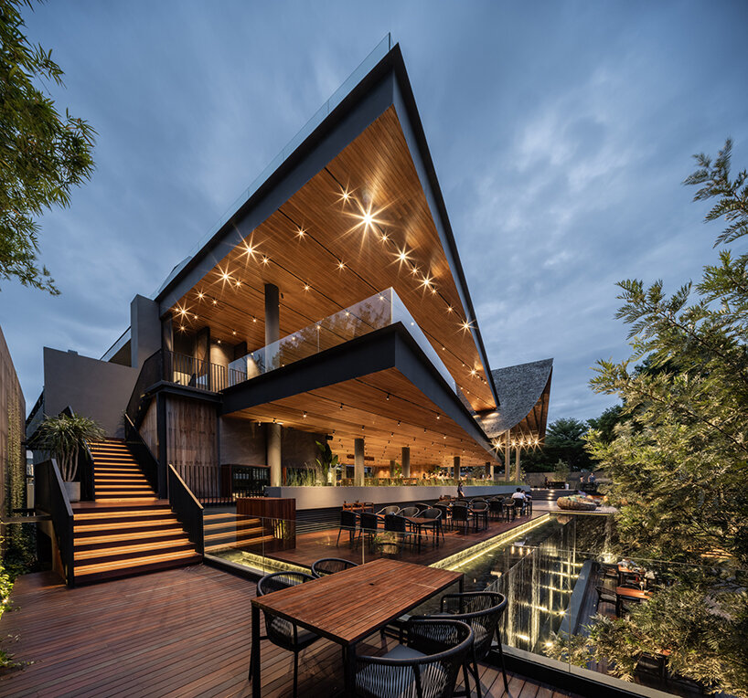 roof ridges dramatically collide atop the new keeree tara riverside in thailand