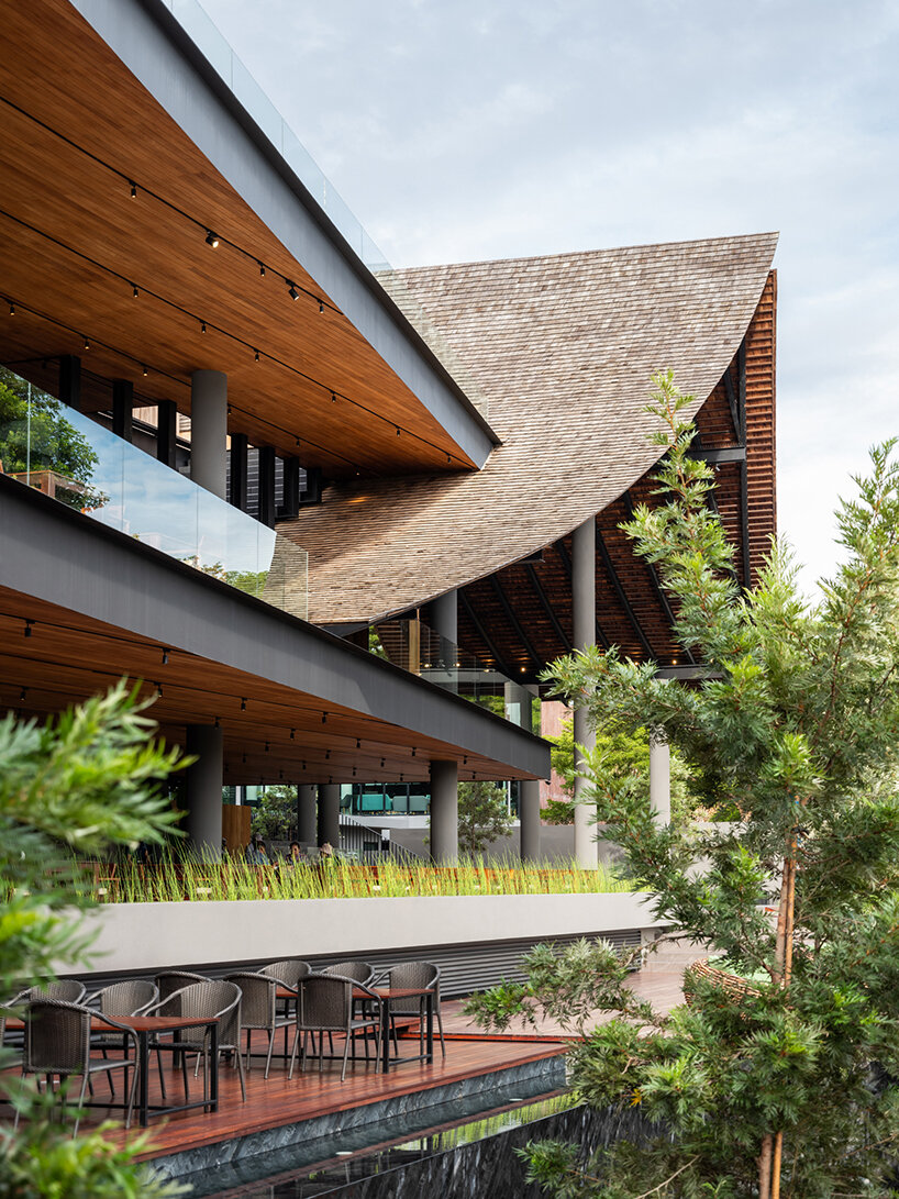 roof ridges dramatically collide atop the new keereetara restaurant in thailand