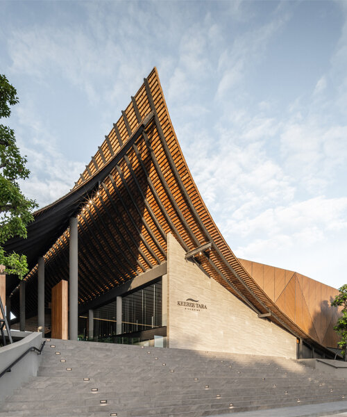 roof ridges dramatically collide atop the new keeree tara riverside in thailand