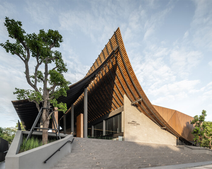 roof ridges dramatically collide atop the new keeree tara riverside in thailand